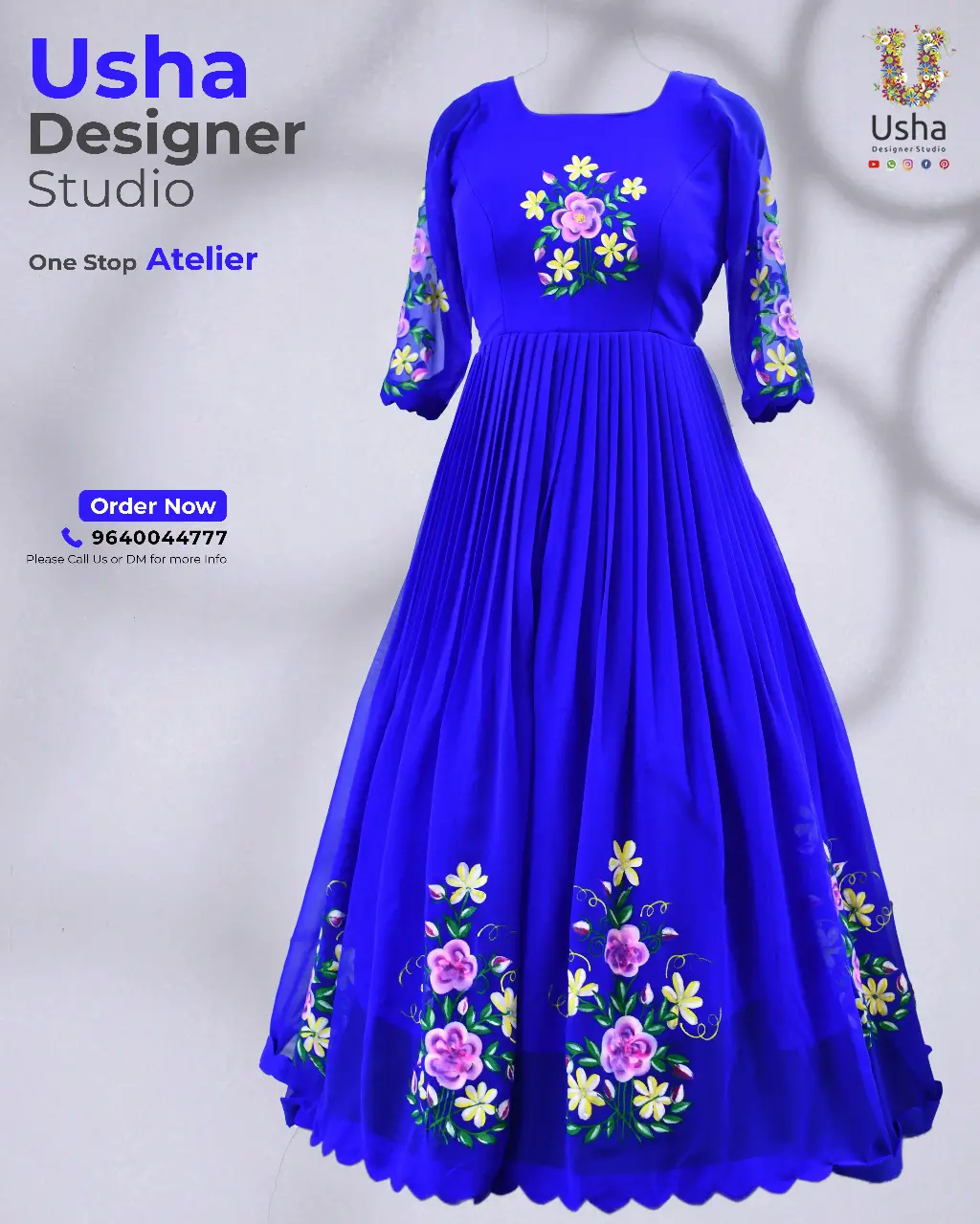 Hand-Painted Royal Blue Long Frock with Scalloped Hemline Royal blue hand-painted long frock with floral motifs, scalloped hemline, and puff sleeves by Usha Designer Studio