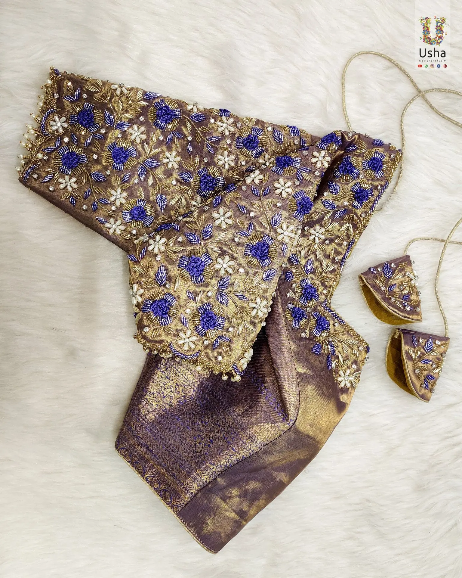 purple bridal blouse with intricate gold Zardosi, white bead, and blue floral Aari and Maggam embroidery, designed by Usha Designer Studio