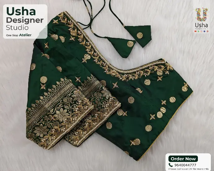 Emerald green bridal blouse adorned with gold zari weaving, floral aari embroidery, and pearl embellishments – handcrafted by Usha Designer Studio