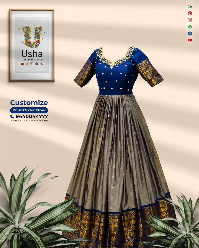 Usha Designer Studio navy blue and antique gold Kanchi Pattu long frock with floral Aari embroidered yoke, diamond neckline, half-inch pleated skirt, and rich zari border. Custom tailored designer long dress.