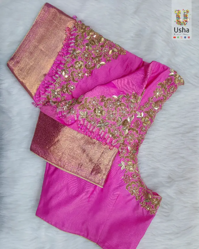Bespoke bridal pink pattu blouse by Usha Designer Studio. Tailor-made with intricate Aari embroidery work for a wedding outfit.