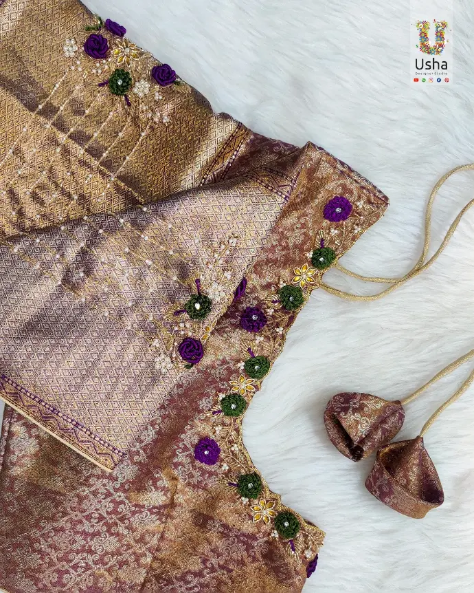 Banarasi silk blouse with intricate Aari embroidery, floral Maggam work, and handcrafted tassels by Usha Designer Studio, Vijayawada.