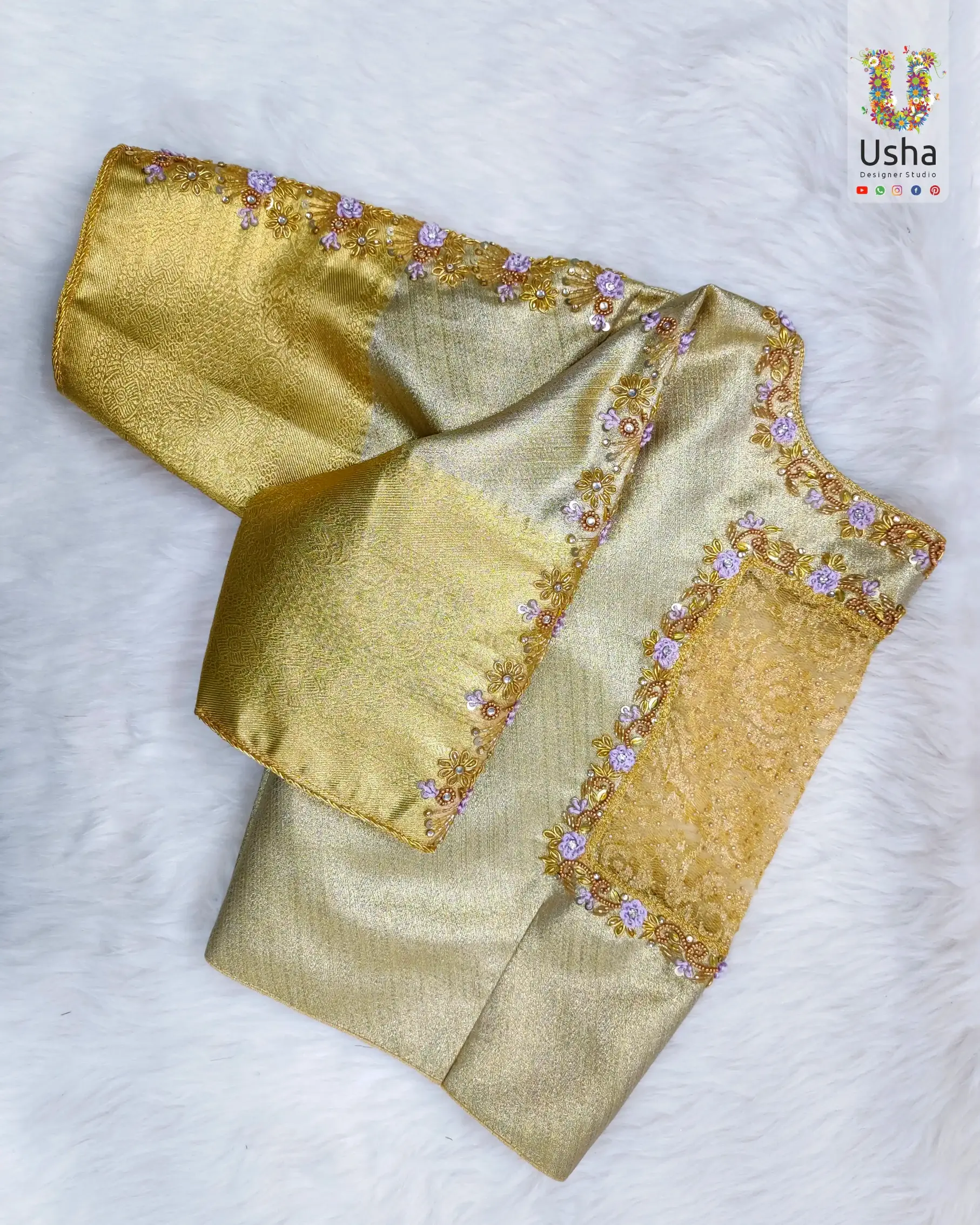 Gold bridal blouse with boat neck, featuring intricate Aari hand embroidery and maggam floral border by Usha Designer Studio Vijayawada