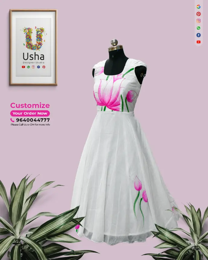 White Indo-Western frock with bold pink lotus floral print, pleated mega sleeves, and full gera designed by Usha Designer Studio Vijayawada.