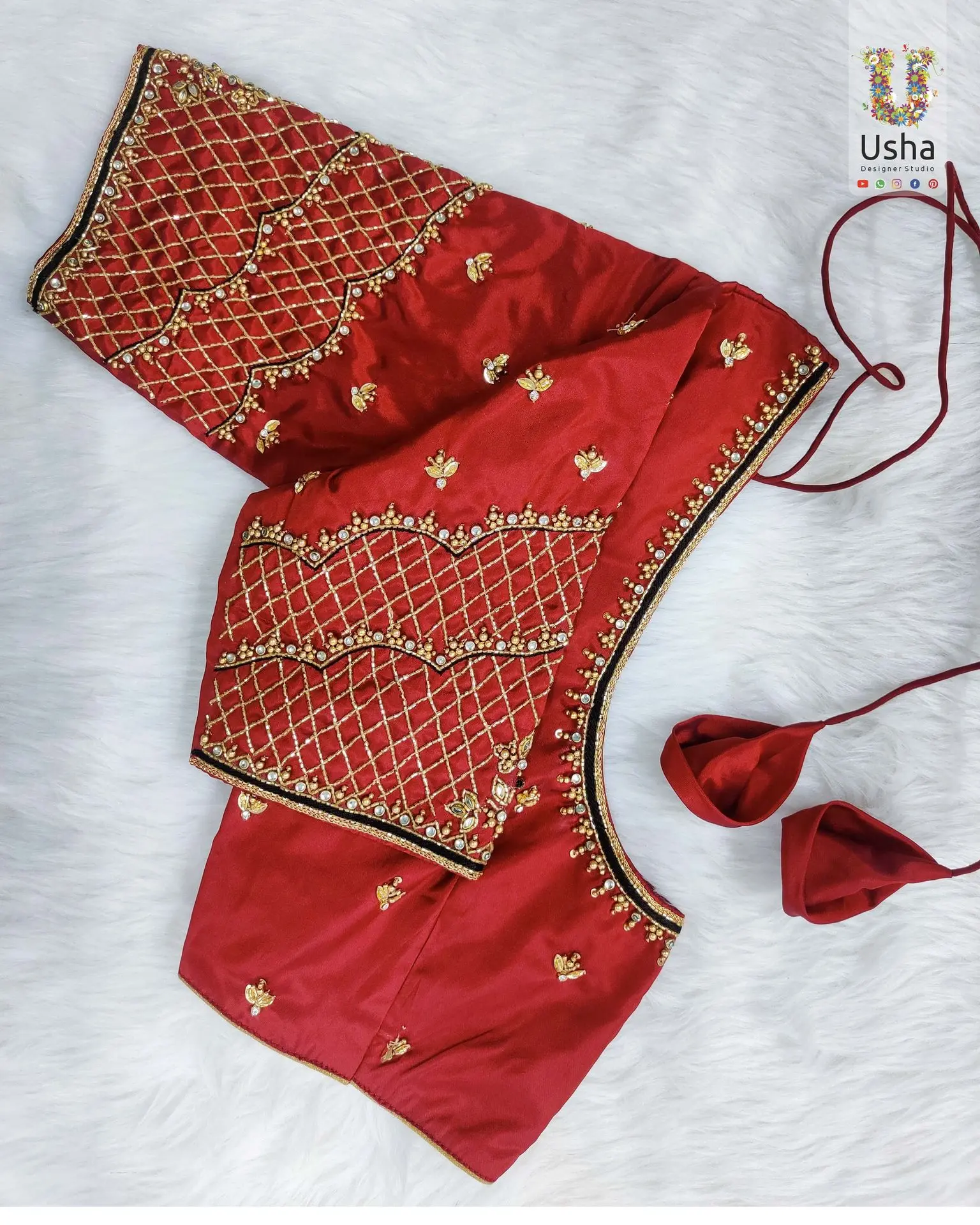 Handcrafted Bridal Aari Work Blouse in Rich Red – Usha Designer Studio, Vijayawada Red bridal blouse with intricate gold Aari embroidery and Maggam handwork by Usha Designer Studio, Vijayawada