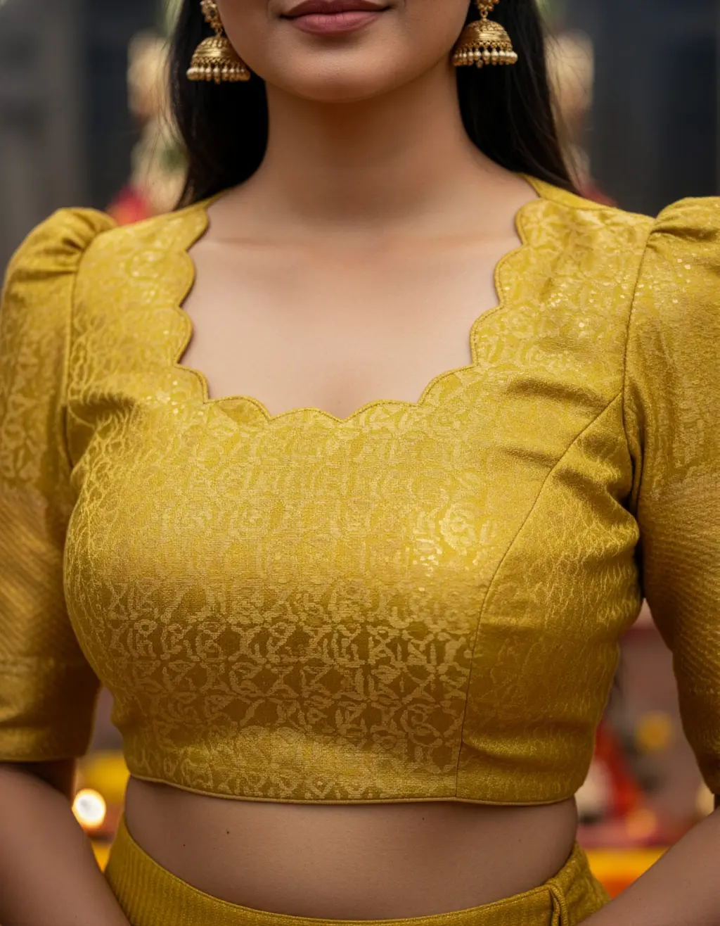 Customized yellow crop top lehenga made from pure gold zari Kota saree featuring scalloped neck, puffed elbow sleeves, pleated skirt, handcrafted latkans, by Usha Designer Studio Vijayawada