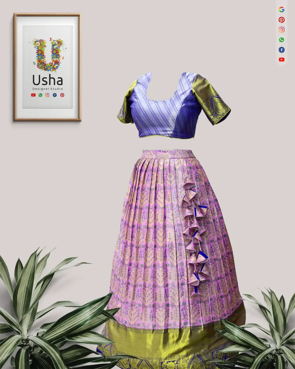 upcycled from a pure Kanchi Pattu Saree. The lehenga is pleated, in shades of lilac and gold, featuring hand-crafted blue and gold heavy latkans on the side. The matching blue and gold brocade choli blouse is visible.