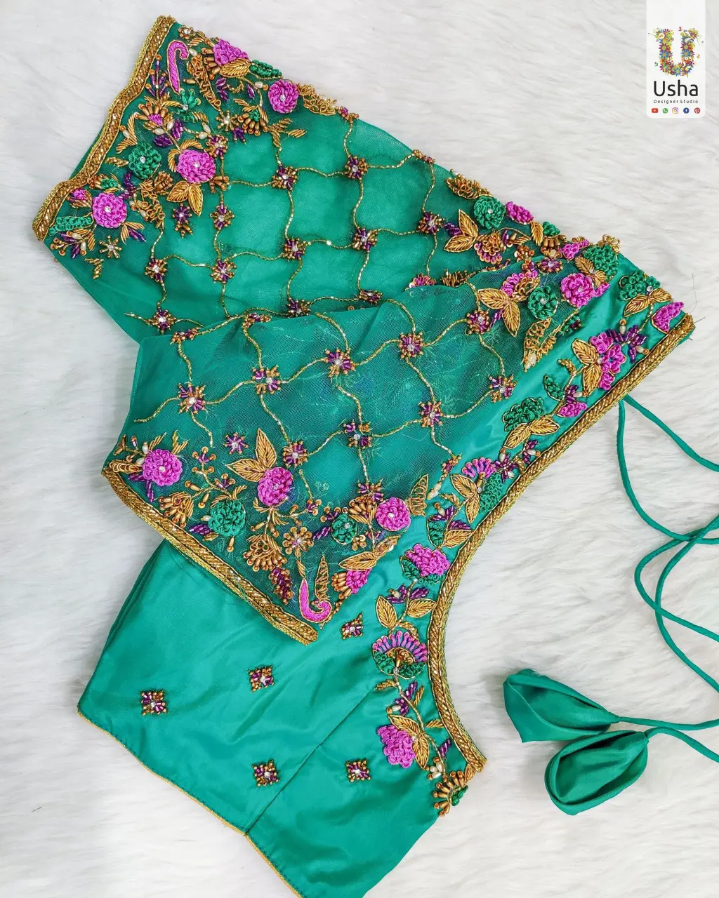 Sea green bridal blouse featuring detailed Maggam and Aari embroidery with floral and gold threadwork, designed by Usha Designer Studio Vijayawada. Luxury Sea Green Bridal Blouse with Intricate Maggam Aari Work – Usha Designer Studio, Vijayawada