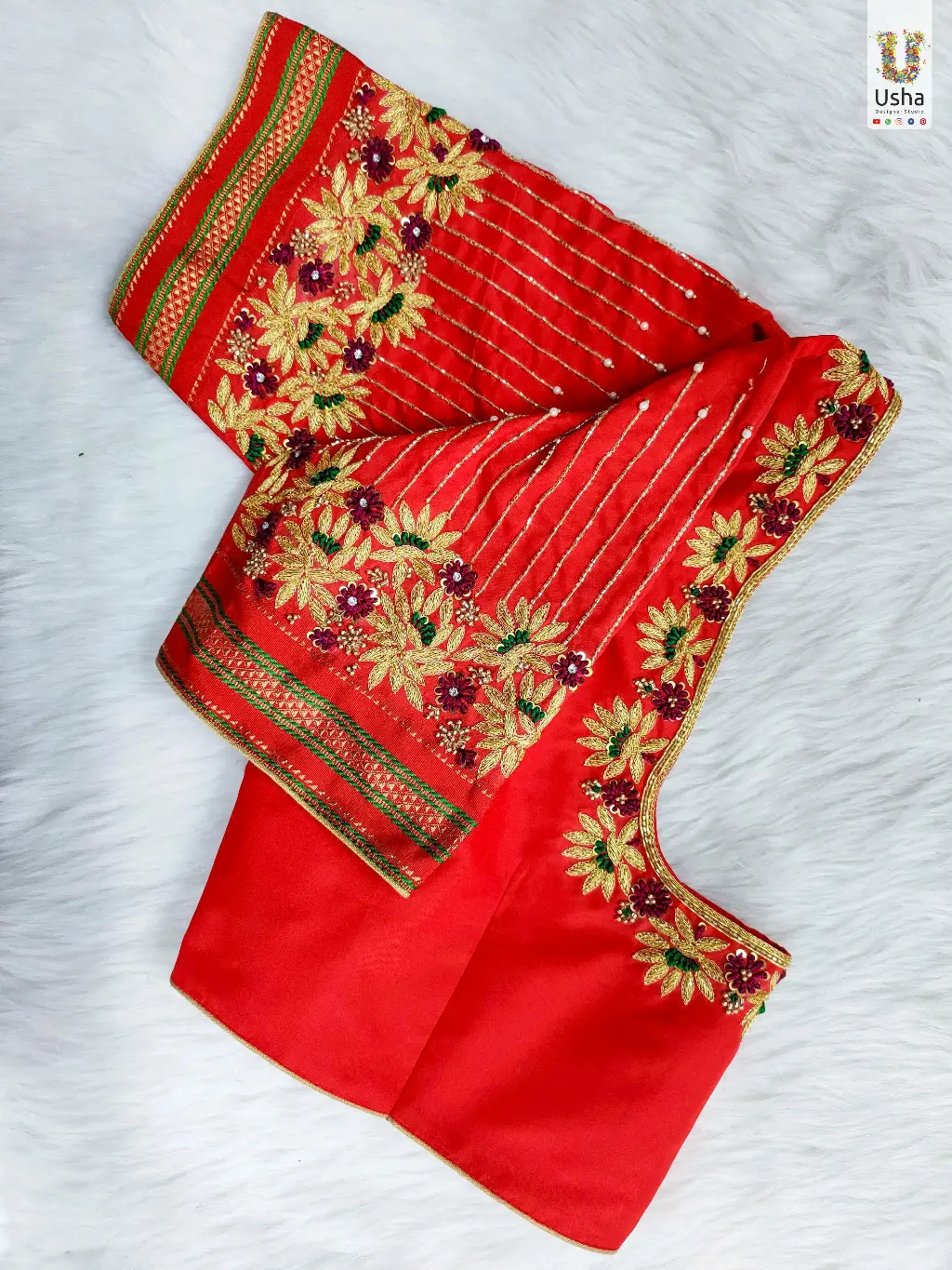 Red Bridal Blouse with Handcrafted Aari Work | Designer Wedding Wear by Usha Designer Studio, Vijayawada Handcrafted red bridal blouse with intricate Aari embroidery, floral zari work and custom designer detailing by Usha Designer Studio, Vijayawada.