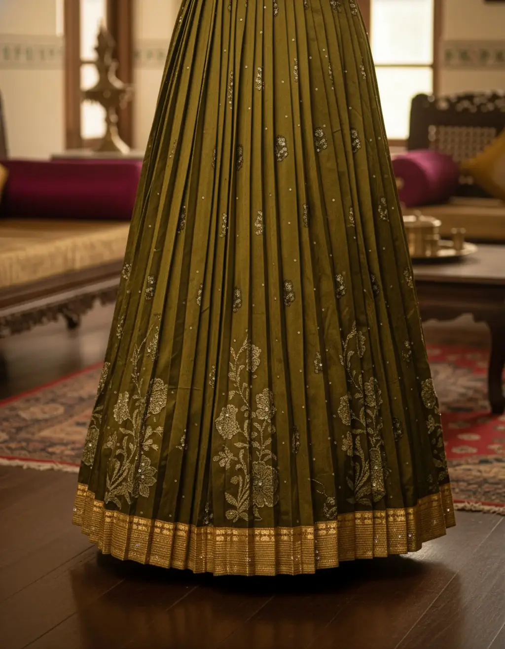 Olive-gold Kanchi Pattu saree converted into pleated long frock with aari-work choli blouse and subtle puff sleeves by Usha Designer Studio Vijayawada.