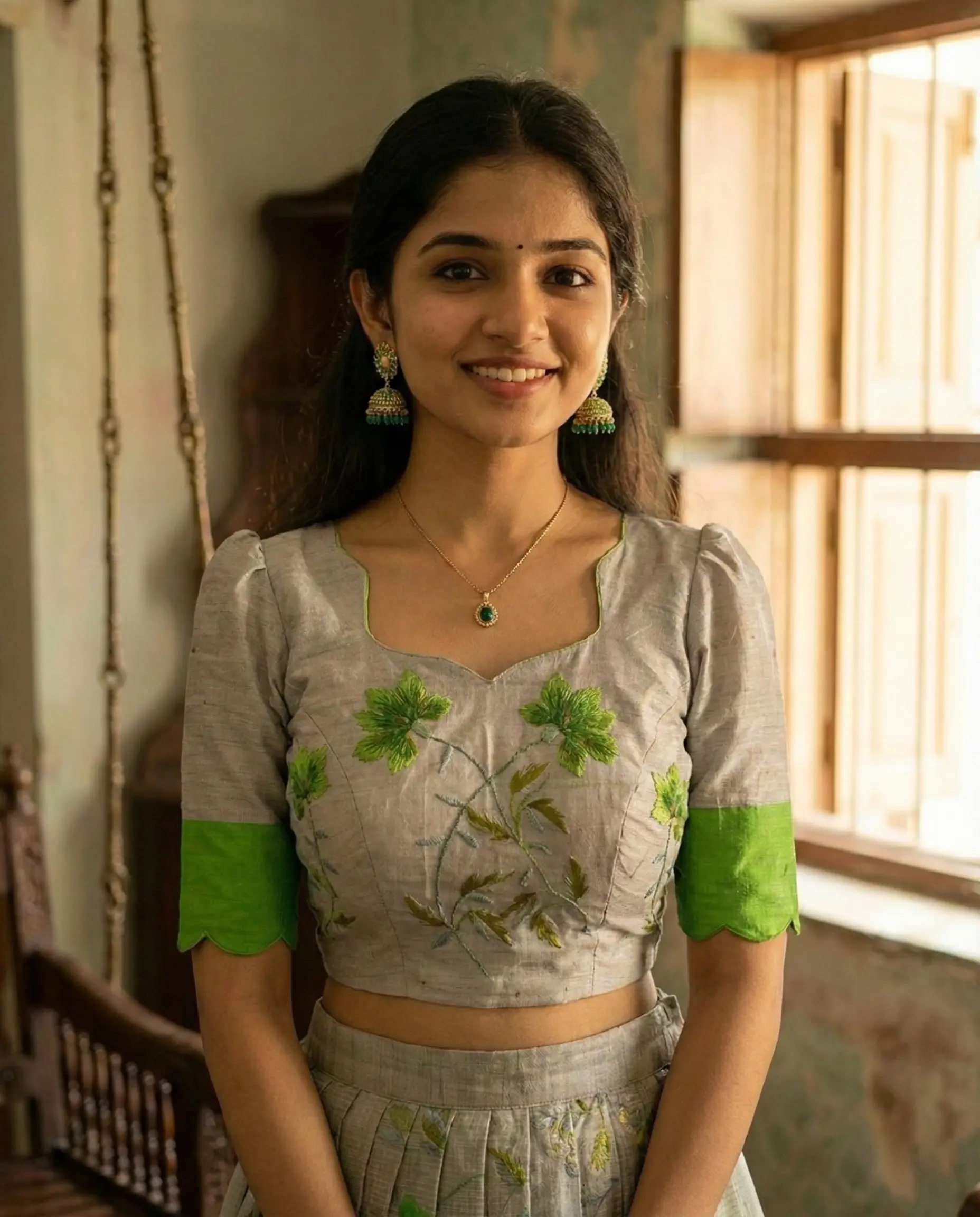 Saree transformed into designer crop top lehenga with heart neckline, puffed elbow sleeves and 1‑inch pleated gera skirt with handcrafted heavy latkans by Usha Designer Studio, Vijayawada.