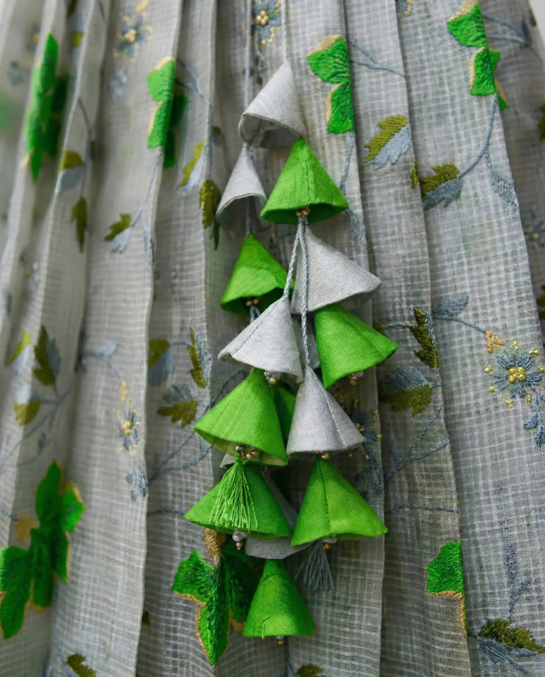 Saree transformed into designer crop top lehenga with heart neckline, puffed elbow sleeves and 1‑inch pleated gera skirt with handcrafted heavy latkans by Usha Designer Studio, Vijayawada.