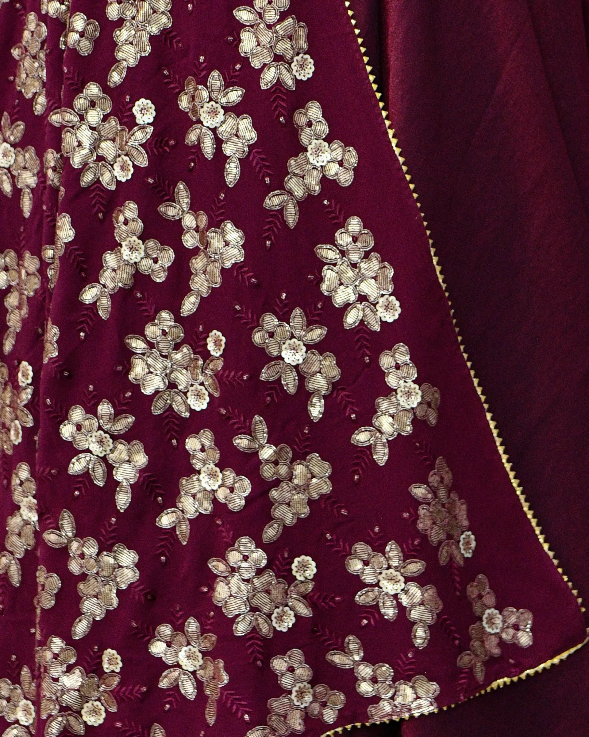 Wine color long frock with U-neck and full sleeves styled with all-over floral sequin and bead embellished georgette dupatta by Usha Designer Studio Vijayawada