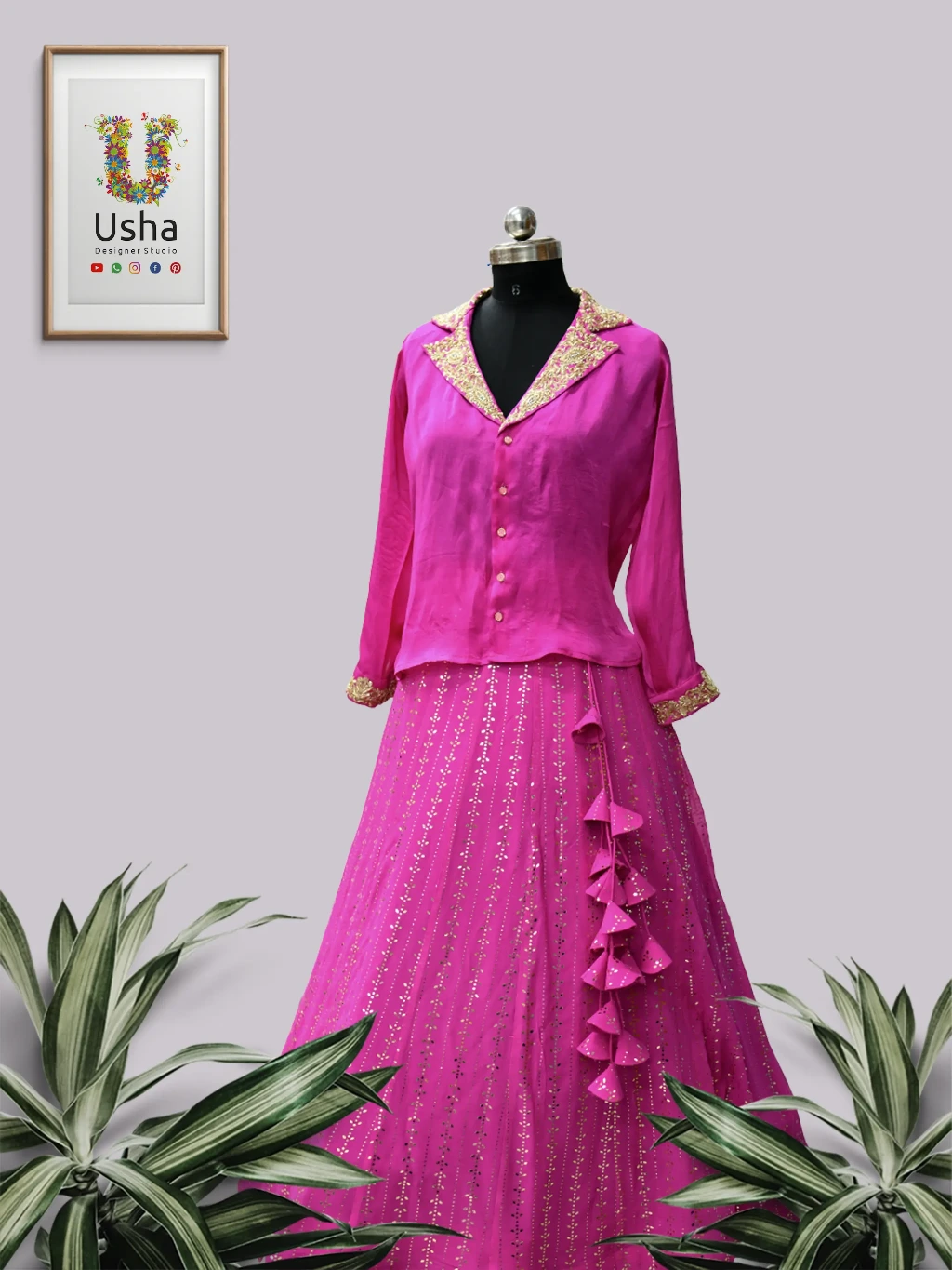 Pink designer crop top lehenga with Chelsea neck collar, intricate gold Aari embroidery, and handcrafted heavy latkans by Usha Designer Studio.
