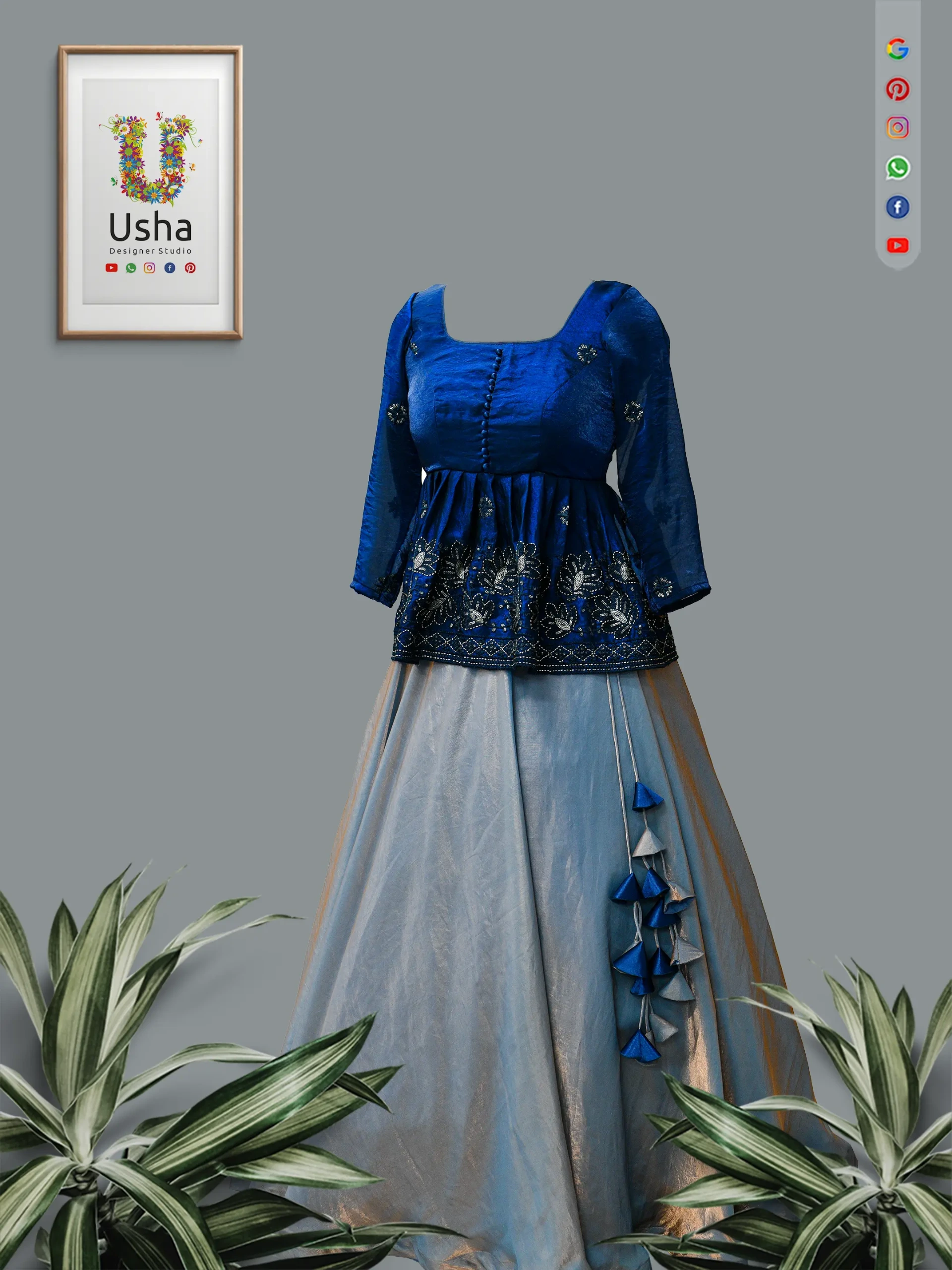 Tailor-Made royal blue Muqmal peplum top with metallic computer-generated floral embroidery, paired with a flared silver Space Silk lehenga skirt and matching tiered tassels.