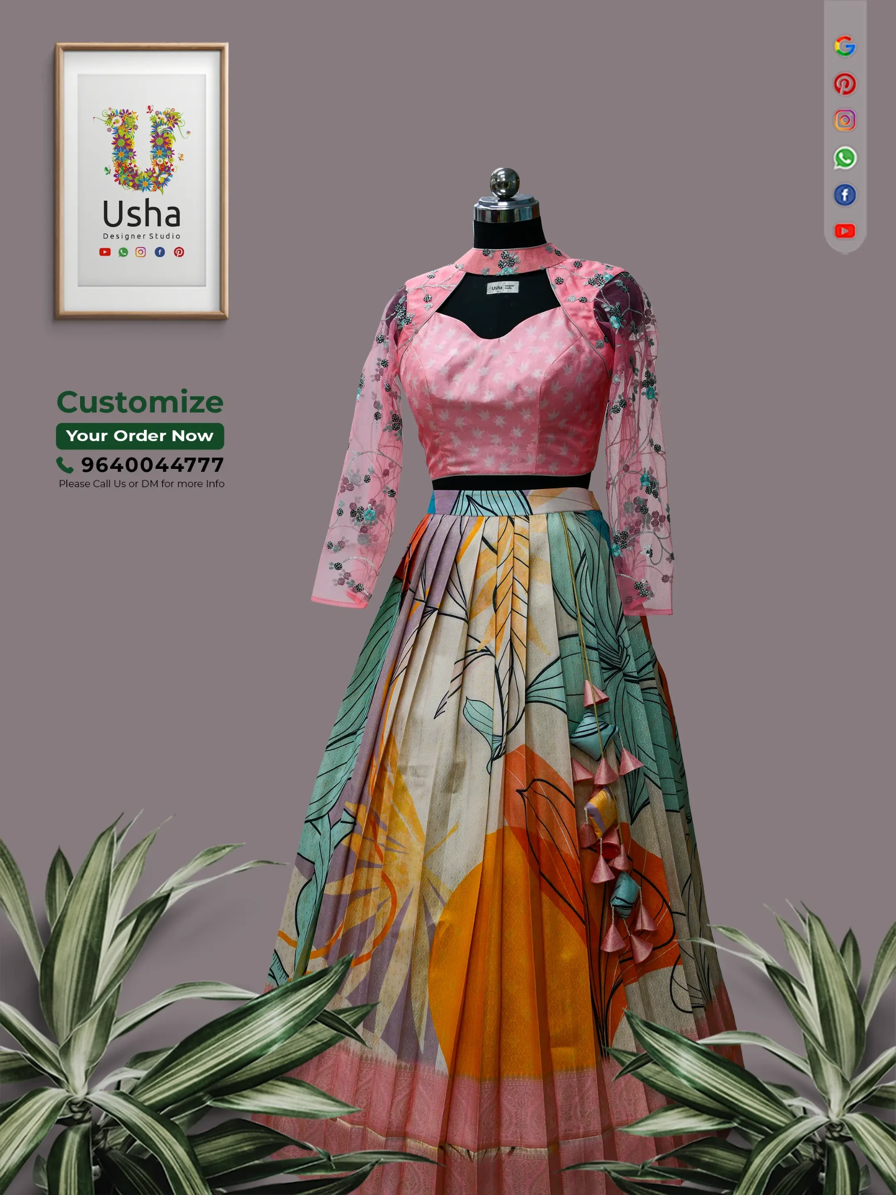 custom Indo-Western lehenga by Usha Designer Studio, featuring a pink embroidered high-neck blouse and a pleated skirt with bold abstract botanical prints, a traditional pink zari border, and matching fabric tassels.